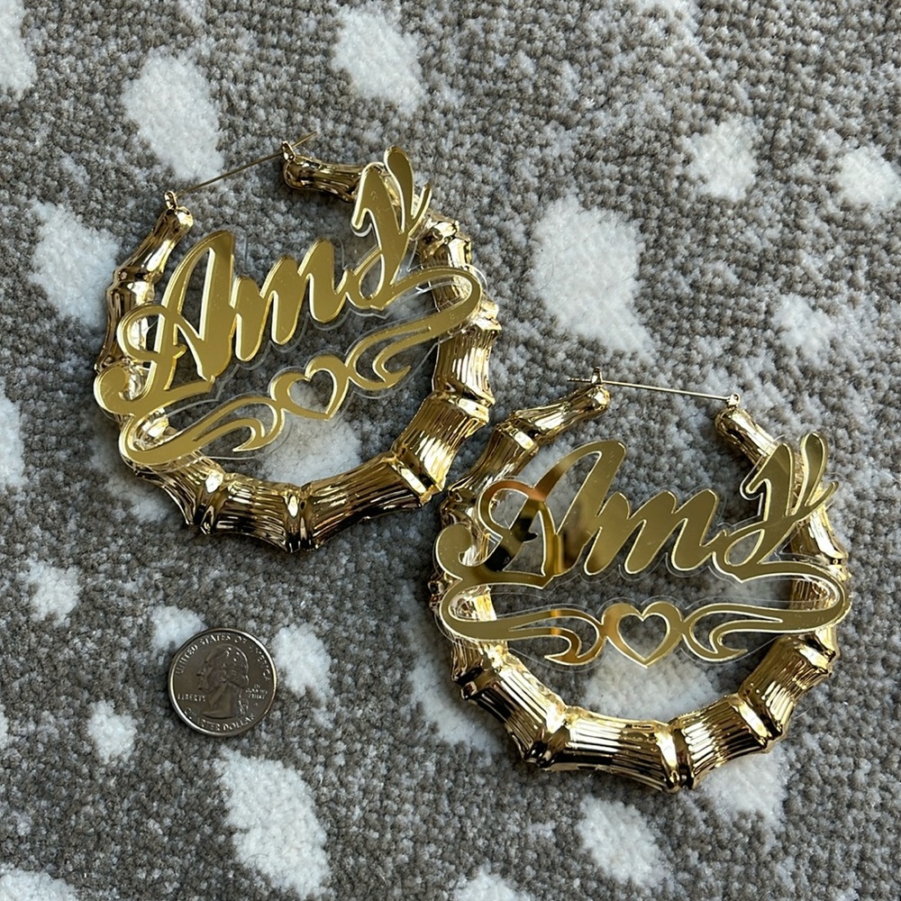 Enormous gold “Amy” hoops. Never worn! Costume. Not particularly heavy.